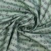 Baumwollstoff „Melodienzauber“ – Hellgrün mit Notenprint