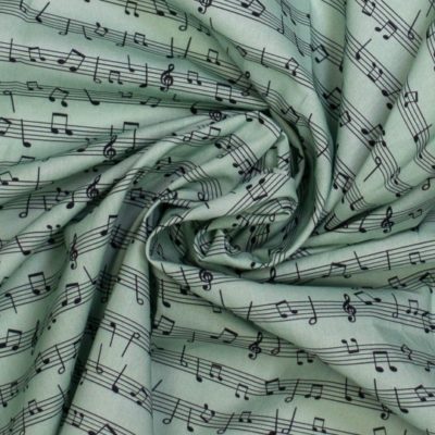 Baumwollstoff „Melodienzauber“ – Hellgrün mit Notenprint