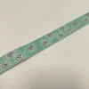Jacquardborte 23 mm – Mint mit Sonnenmotiv